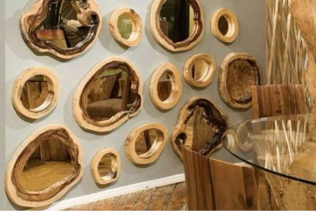 A wall gallery display of multiple rustic mirrors framed in natural live-edge wood slices.