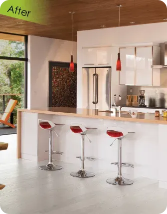 fter view of a contemporary open-concept kitchen renovation showcasing glossy white minimalist cabinetry, stainless steel appliances, and a natural wood ceiling.