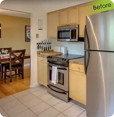Before view of an outdated kitchen remodel project featuring basic maple wood cabinets, beige tile flooring, and a standard stainless steel refrigerator.
