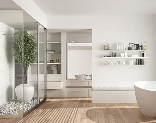 Luxury modern master bathroom with glass shower, wood floors, and soaking tub