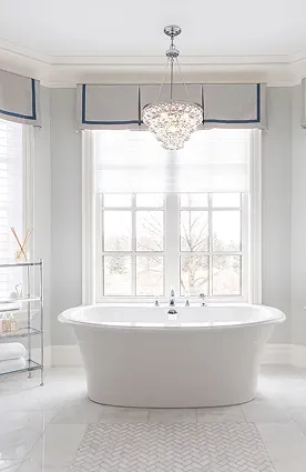 Minimalist white bathroom remodel with freestanding tub and open shower