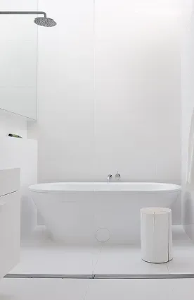 Minimalist white bathroom remodel with freestanding tub and open shower