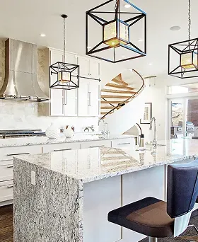 Luxury kitchen renovation with granite countertops, geometric pendant lights, and a spiral staircase
